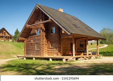 Log house in a country side in a sunny day  - Shutterstock ID 1141195694