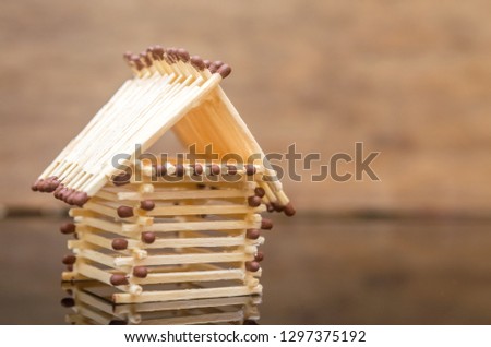 Log house from matches pattern