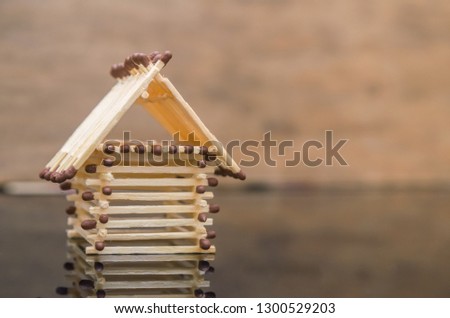 Log house from matches pattern