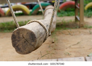 Log Swing In The Play Ground.selective Focus On Rope