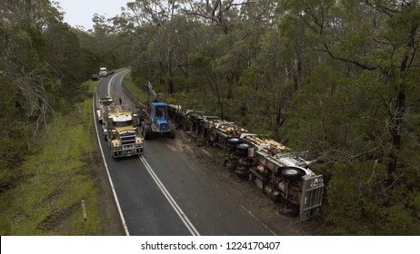 Log truck rolled over after crash on the Portland-Nelson Road, Australia - October 21, 2016.  The driver was uninjured.