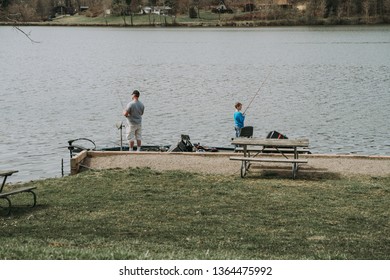 Logan, Ohio / USA - 4/6/2019: Father And Son Boat Fishing On Lake Logan