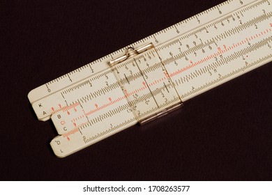 Logarithmic ruler on a wooden table. Stationery for engineers and students. Logarithmic Slide Rule.