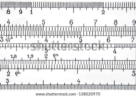 Logarithmic scale of the slide rule extremal close up. Mathematics and science abstract background