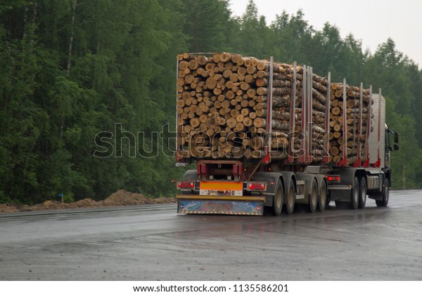 Logging truck on the\
highway.