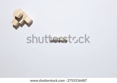 Logic concept symbolizing reasoning, analysis, and problem solving using wooden blocks and letter tiles.