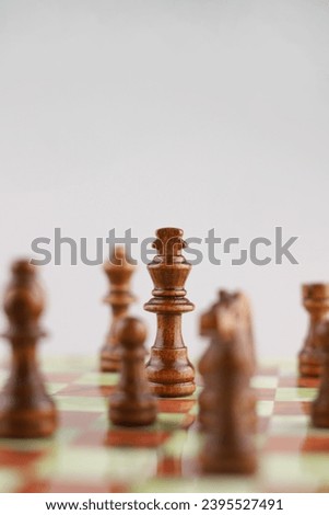logic game of chess. on the chessboard in the center of attention is the figure of the king and around the rest of the chess pieces