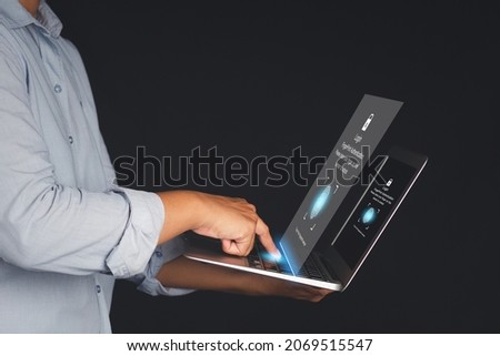 The login page by fingerprint on the virtual screen to the computer system on the laptop. Business, technology, communication, networking, and security concept.