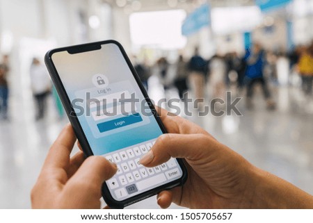 Login with smartphone to online bank account or personal information on internet. Registration to social media app. Hands typing and entering username and password to an imaginary mobile application.