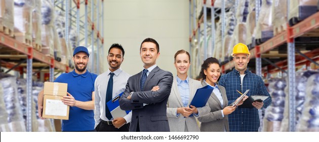 Logistic Business, Delivery Service And People Concept - Happy International Team Of Employees Over Warehouse Background