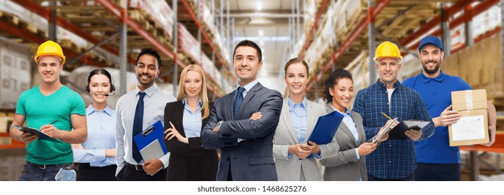 Logistic Business, Delivery Service And People Concept - Happy International Team Of Employees Over Warehouse Background