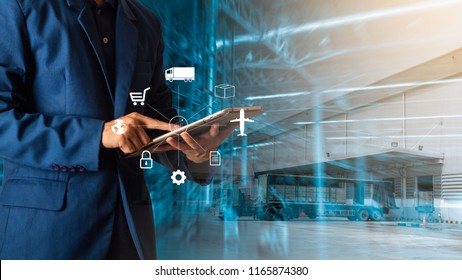 Logistic and transport concept : Businessman manager using tablet check and control and planning for Modern Trade warehouse logistics. - Shutterstock ID 1165874380