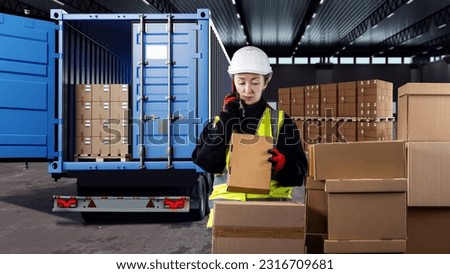 Logistician woman. Dispatcher in warehouse building. Storekeeper with cardboard boxes. Logistician near truck. Loading boxes into truck. Woman logistician makes phone call. Girl logistics manager