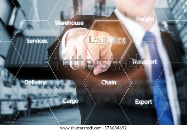 Logistics concept with businessman hand\
holding digital tablet shipping icons use for import, export and\
logistics background.
