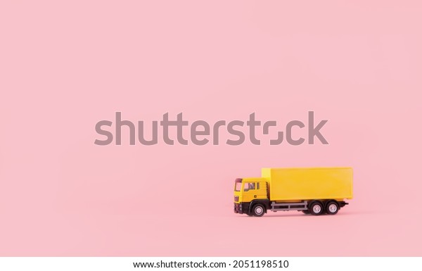Logistics, and delivery service - Cargo truck and\
on Pink background. Shopping service on The online web and offers\
home delivery. with copy\
space