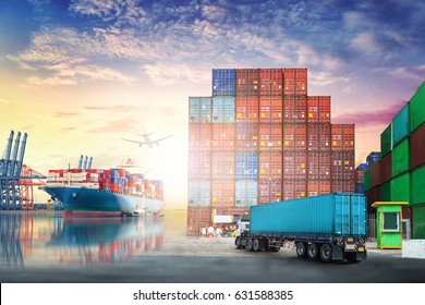 Logistics import export background and transport industry of Container truck and Cargo ship in seaport at sunset sky - Shutterstock ID 631588385