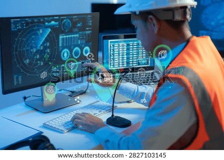 logistics operator using GPS radar and real-time fleet management dashboard on computer.