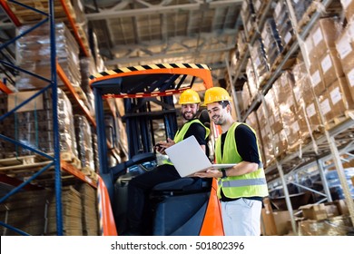 Logistics People Working In Warehouse