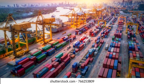 Logistics and transportation of Container Cargo ship and Cargo plane with working crane bridge in shipyard at sunrise, logistic import export and transport industry background - Shutterstock ID 766253809