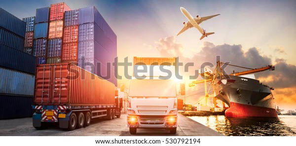Logistics and\
transportation of Container Cargo ship and Cargo plane with working\
crane bridge in shipyard at sunrise, logistic import export and\
transport industry\
background
