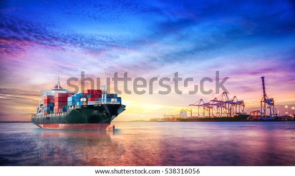 Logistics and transportation of International\
Container Cargo ship in the ocean at twilight sky, Freight\
Transportation,\
Shipping