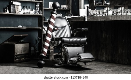 Logo of the barbershop, symbol. Stylish vintage barber chair. Hairstylist in barbershop interior. Barber shop chair. Barbershop armchair, salon, barber shop for men. Barber shop pole. Black and white.