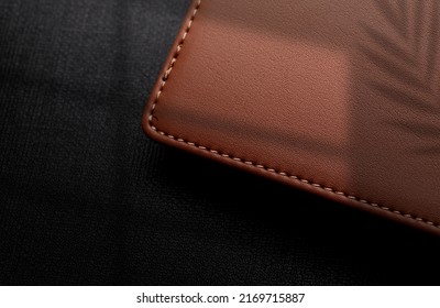 Logo mockup on leather box On a black background with shadows