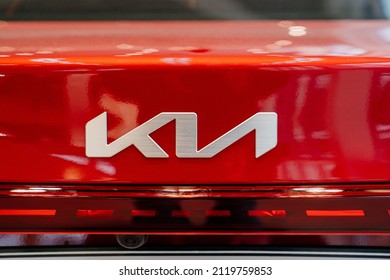 logo on the New red KIA car in the car dealership. rent, sale of cars at an authorized dealer. Russia, Rostov-on-Don, motor showroom KLYUCHAVTO, 20.12.2021