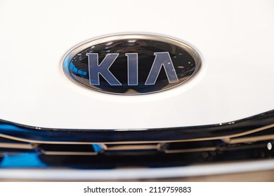 logo on the New white KIA car in the car dealership. rent, sale of cars at an authorized dealer. Russia, Rostov-on-Don, motor showroom KLYUCHAVTO, 20.12.2021