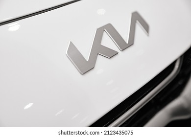 logo on the New white KIA car in the car dealership. rent, sale of cars at an authorized dealer. Russia, Rostov-on-Don, motor showroom KLYUCHAVTO, 20.12.2021