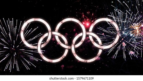 Logo rings of the Olympic Games with fireworks in the background, design typography design, 05/12/2019 - Agen - France