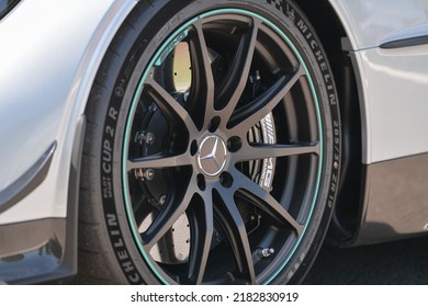 The Logo Sign Of A Mercedes Benz AMG GT S Premium Luxury Racing Car And The Custom Made Wheel Rim. Romania, 2022.