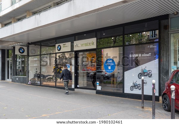 Logo View of BMW MOTORRAD Brand BMW motorbike\
on Front of french Store Facade with brand signage in Paris, France\
famous brand for motor bike and motorcycle products BMW MOTORRAD\
Brand BMW motorbike