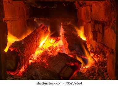 Logs Burning In Ancient Peasant Masonry Oven In Ukraine