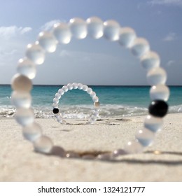 Lokai Bracelets On Beach Of Klein Curaçao