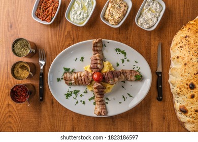 Lokum Kebab, traditional Turkish Lamb kebab served with homemade mezes and pide bread - Shutterstock ID 1823186597