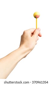 Lollipop In Female Hand Isolated On White Background. Alpha. Chupa Chups.