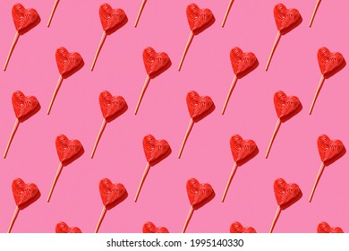 Lollipop heart shaped candy pattern, top view.