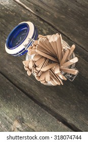 Lollipop Sticks In A Jar On Wooden Board