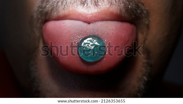 lollipop from the throat which is on the tongue of a\
man. guy eating pills cough sore throat pastille. Male With Cough\
Drop. Sore Throat and Cough Lozenges. blue drugs lsd. l.s.d.\
ecstasy. JWH-018  
