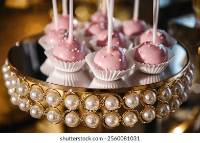 Lollipops pink. Delicious reception for birthday party or baptism. Wedding candy bar. Celebration concept. Table with sweets, candies, and dessert. - Powered by Shutterstock