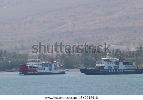 lombok - 13/11/2019\
activity of passenger ships\
from Lombok to Sumbawa Indonesia. ship door. the car boarded the\
ship. ship docked. ship\
runs
