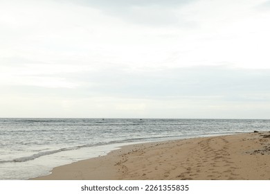 Lombok and Gili Air islands, overcast, cloudy day, sky and sea. Vacation, travel, tropics concept, no people. Sunset, sand beach.