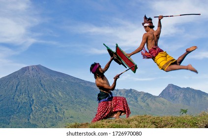 LOMBOK, INDONESIA - MAY 15, 2015: Culture Of Lombok People That Two Fighter Fighting With Stick And Use Traditional Clothes. This Culture In Local Language Call 