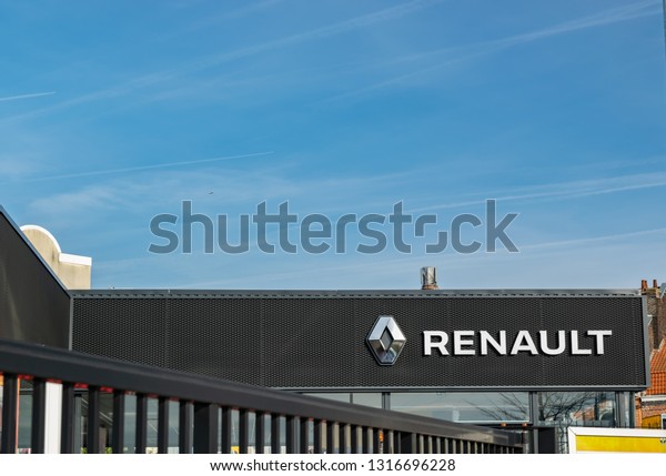 Lomme,FRANCE-February\
17,2019: Renault company logo on the dealership building.Renault it\
is a French car manufacturing company, founded in 1899.The leader\
in the sale of cars in the\
world.
