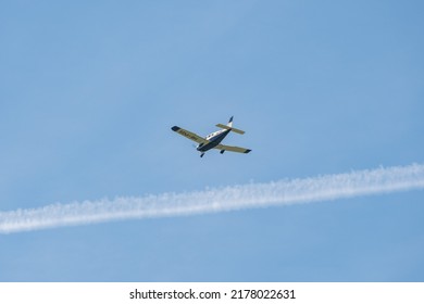 Lommis, Switzerland, May 11, 2022 Piper PA28-181 Archer III Propeller Plane In The Blue Sky