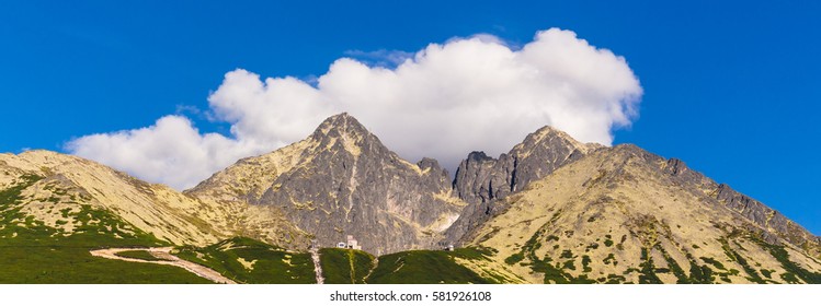 Lomnicky peak on cloud background. Slovak Tatra mountains. Mountain scenery.