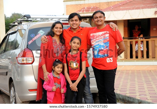 Lonavala, Maharashtra, India,
Asia Nov. 2015 - Indian Happy Family with Newly Purchased Car in
background