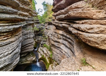 Rosomački Lonci (canyon of river Rosomača) in Stara Planina mountains are called Rosomački pots, because of the unusual shape, edges layered with multiple extensions with whirlpools