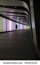 LONDON, 16 August 2016: Silhouette Of Man Walking At Kings Cross St Pancras Tube Station Walkway.